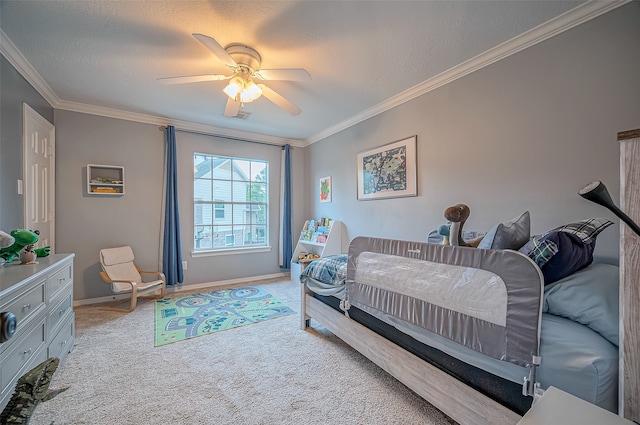 carpeted bedroom featuring ceiling fan, crown molding, and a textured ceiling