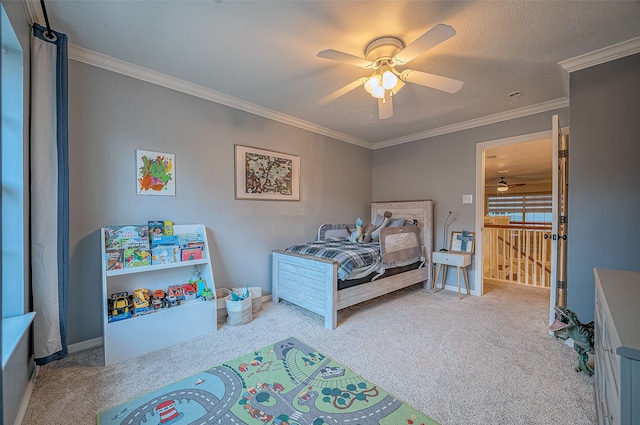 bedroom featuring ornamental molding, light colored carpet, and ceiling fan