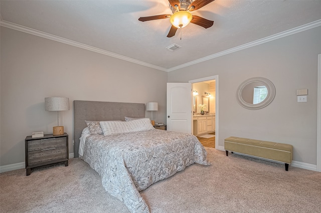 bedroom with ornamental molding, carpet, ensuite bathroom, and ceiling fan