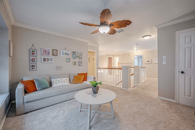 living room with crown molding, light colored carpet, and a textured ceiling