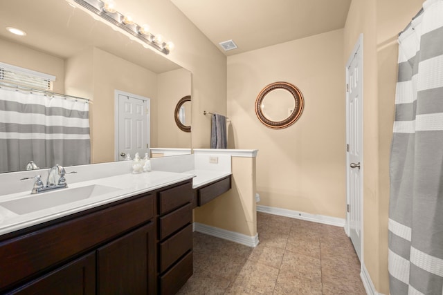 bathroom featuring vanity, toilet, and tile patterned flooring