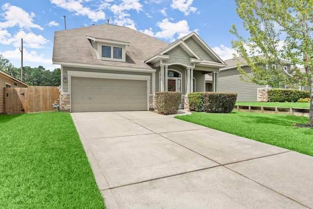 craftsman-style house with a front yard