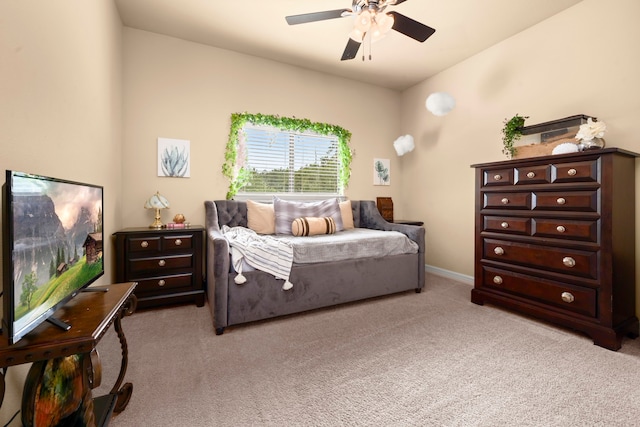 bedroom featuring ceiling fan and light colored carpet