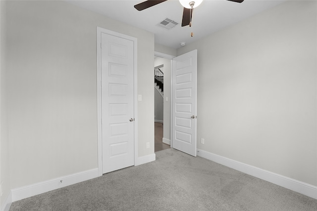 unfurnished bedroom with light carpet and ceiling fan