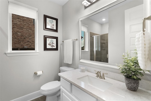 bathroom featuring vanity, toilet, tile patterned flooring, and an enclosed shower