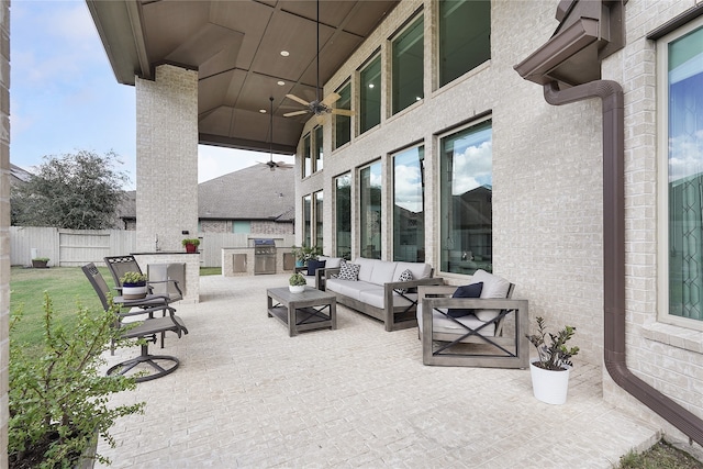 view of patio featuring an outdoor living space, a grill, and ceiling fan