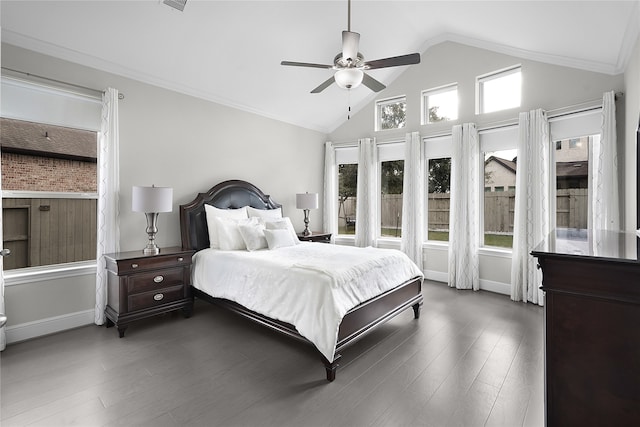 bedroom featuring dark hardwood / wood-style flooring, lofted ceiling, crown molding, and ceiling fan