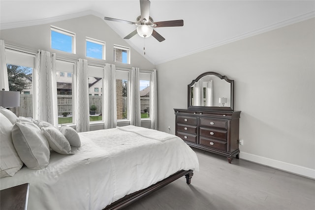 bedroom with light hardwood / wood-style flooring, multiple windows, ornamental molding, and ceiling fan