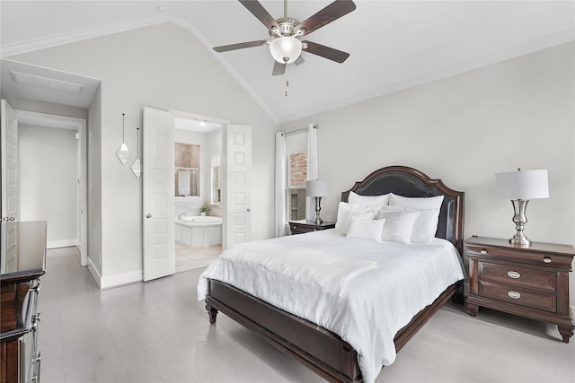 bedroom with ceiling fan, light wood-type flooring, vaulted ceiling, ornamental molding, and ensuite bath