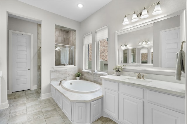 bathroom with vanity, independent shower and bath, and tile patterned flooring