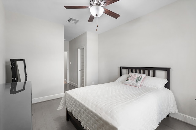 bedroom with dark wood-type flooring and ceiling fan