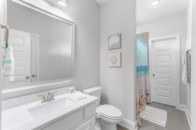 bathroom with vanity, a shower with curtain, toilet, and tile patterned floors