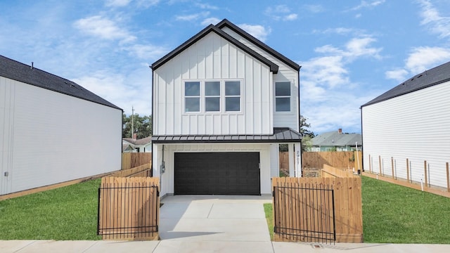 view of front of property with a front lawn and a garage