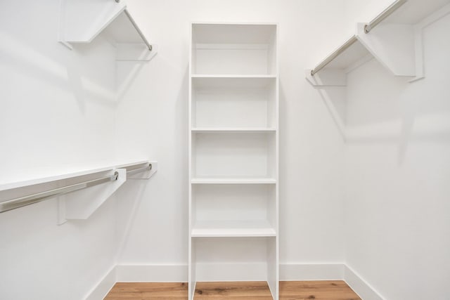 walk in closet featuring hardwood / wood-style flooring