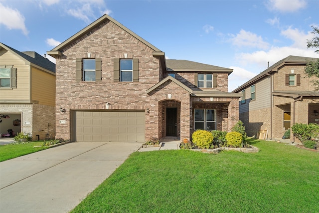 view of front facade with a front yard and a garage