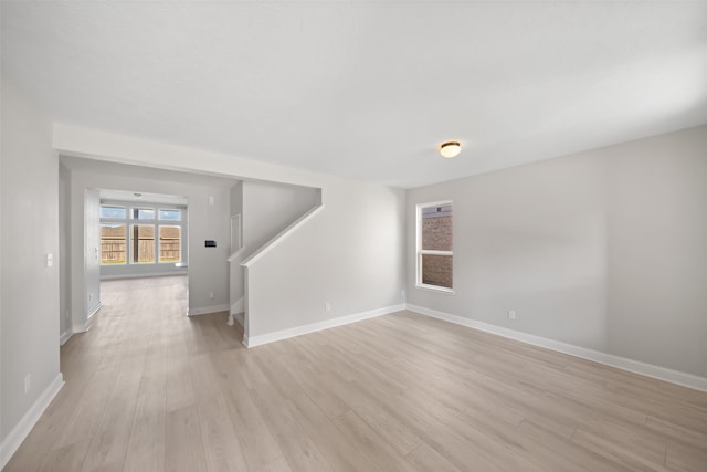 spare room featuring light hardwood / wood-style floors