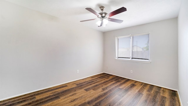 unfurnished room with ceiling fan and dark hardwood / wood-style flooring