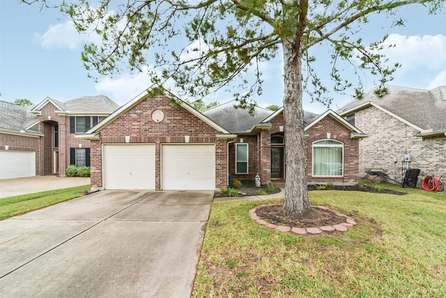 view of front of house featuring a front yard and a garage