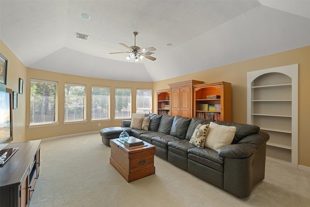 living room with ceiling fan, a healthy amount of sunlight, and light colored carpet