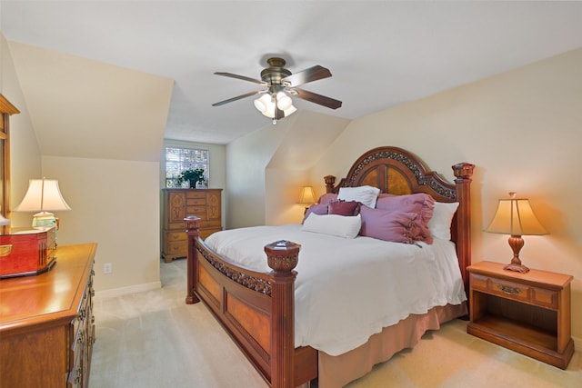 carpeted bedroom featuring ceiling fan and lofted ceiling