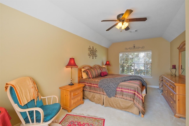 carpeted bedroom with vaulted ceiling and ceiling fan