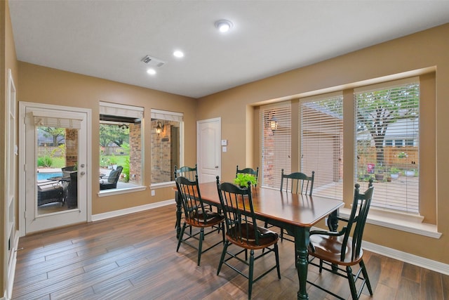 dining area featuring dark hardwood / wood-style floors