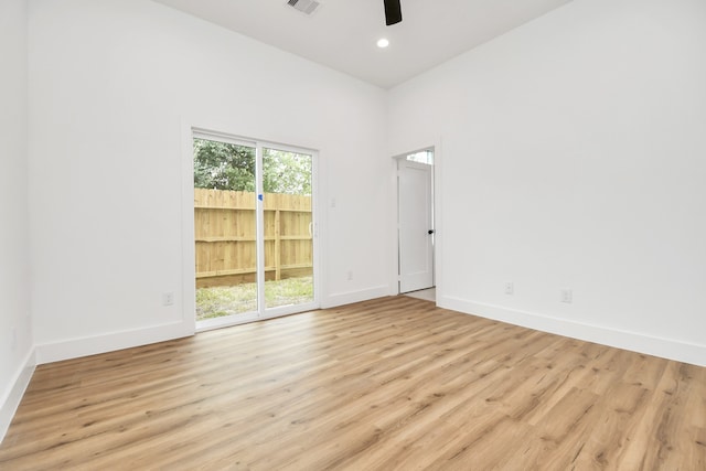 unfurnished room featuring ceiling fan and light wood-type flooring