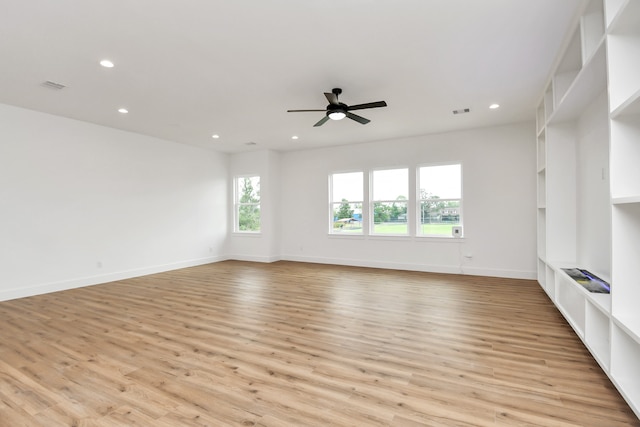 unfurnished living room with ceiling fan and light hardwood / wood-style flooring