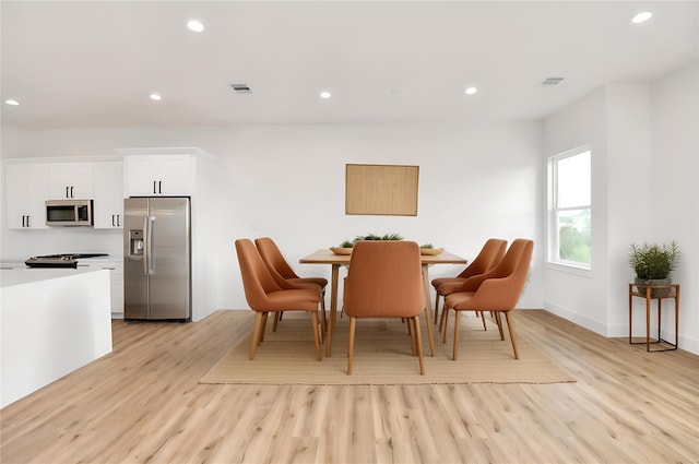 dining space featuring light hardwood / wood-style flooring