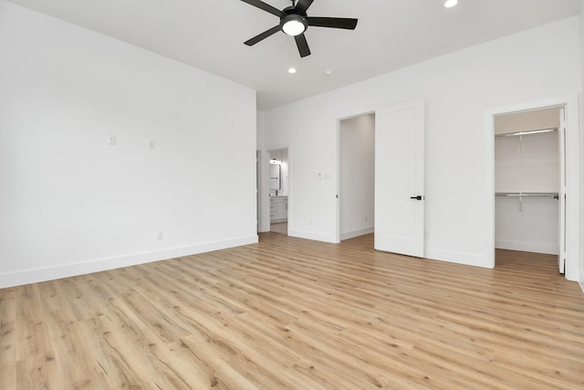 unfurnished bedroom with attic access, recessed lighting, light wood-style flooring, and baseboards