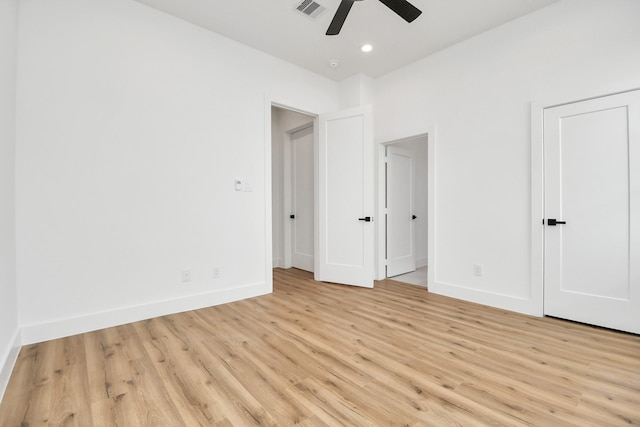 unfurnished bedroom featuring light wood finished floors, baseboards, visible vents, and recessed lighting