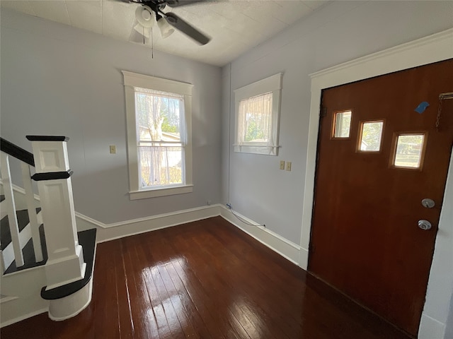 entryway with ceiling fan and dark hardwood / wood-style flooring