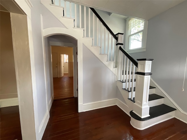 stairs with hardwood / wood-style floors