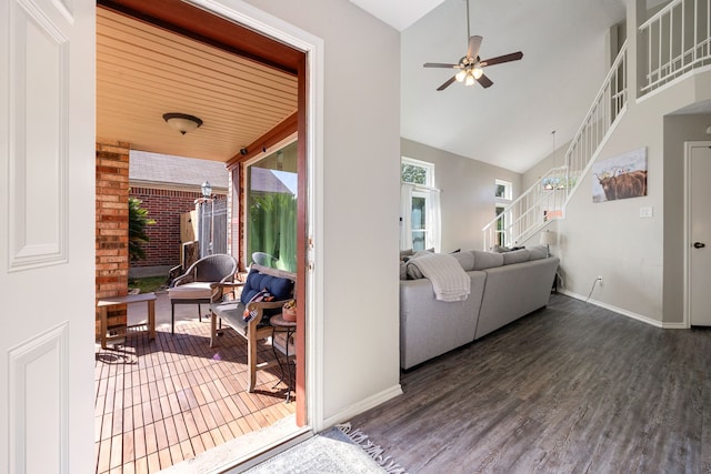 7415 Cavesson Dr, Cypress, TX 77433 - living room featuring a ceiling fan, wood finished floors, baseboards, stairs, and high vaulted ceiling