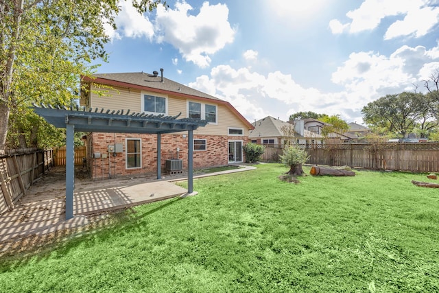 rear view of property featuring a patio, cooling unit, a yard, and a pergola