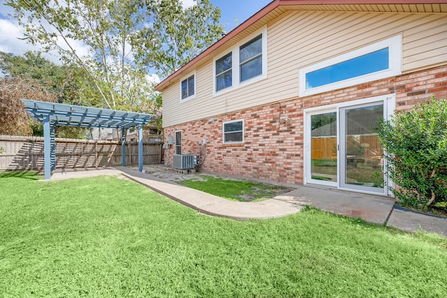 7415 Cavesson Dr, Cypress, TX 77433 - back of house with brick siding, a pergola, central air condition unit, and a patio area