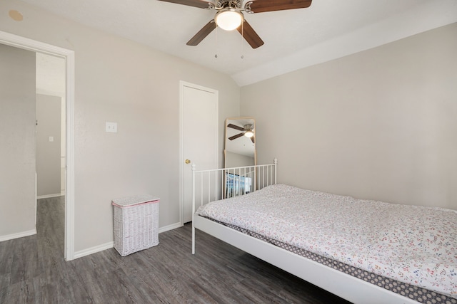 bedroom featuring lofted ceiling, dark hardwood / wood-style floors, and ceiling fan