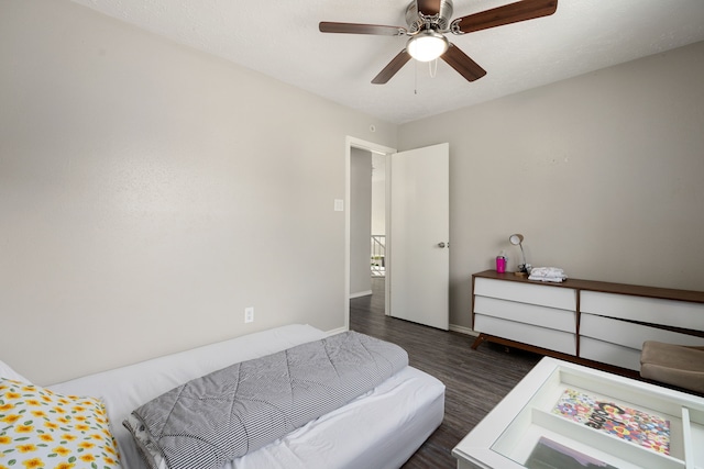 bedroom featuring dark wood-type flooring and ceiling fan