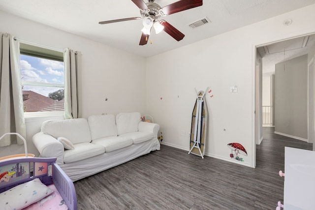 living room with dark hardwood / wood-style floors, a textured ceiling, and ceiling fan