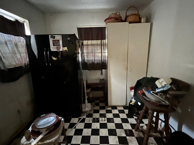 kitchen with black fridge