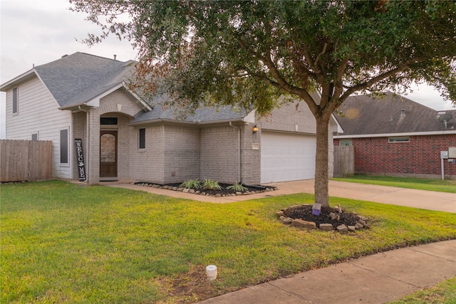 view of front facade featuring a front yard and a garage