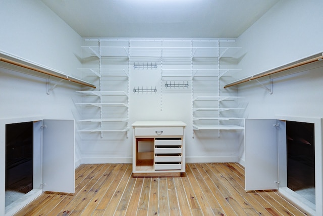 walk in closet featuring light hardwood / wood-style floors