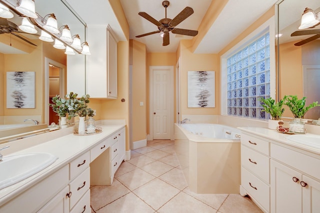 bathroom with tile patterned floors, vanity, and a tub