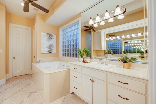 bathroom featuring ceiling fan, vanity, tile patterned flooring, and a bathtub