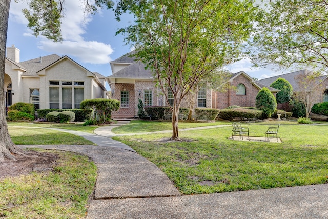 view of front of property with a front lawn