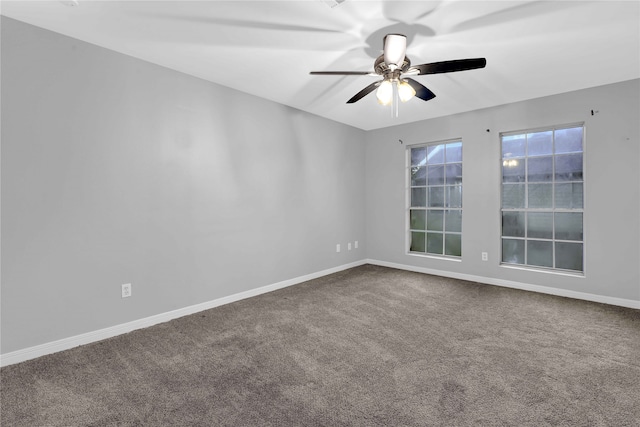 carpeted empty room with ceiling fan