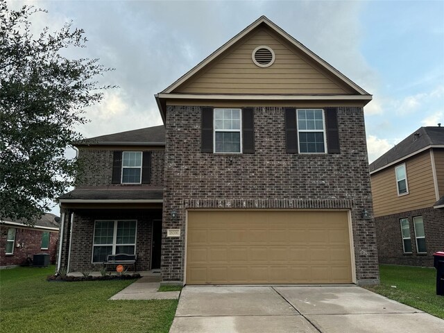 18006 Seco Creek Ln, Humble, TX 77396 - front facade with central air condition unit, a front yard, and a garage