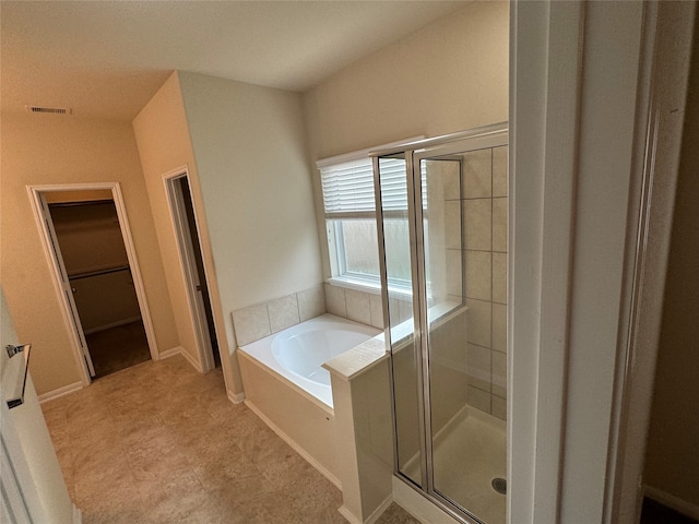 bathroom featuring plus walk in shower