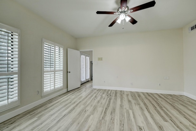 empty room with ceiling fan and light wood-type flooring