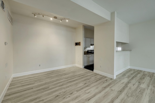 unfurnished living room with light wood-type flooring